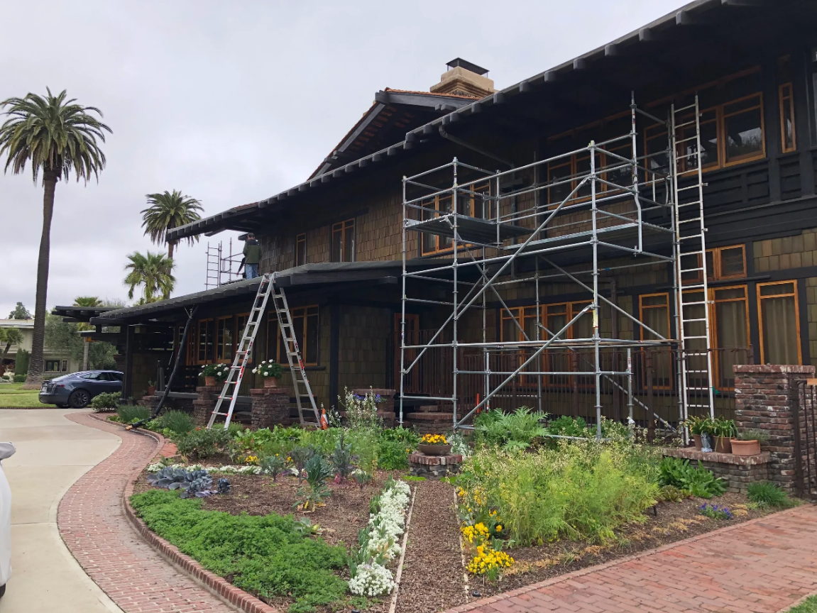 Two-story home with scaffolding in Altadena, CA